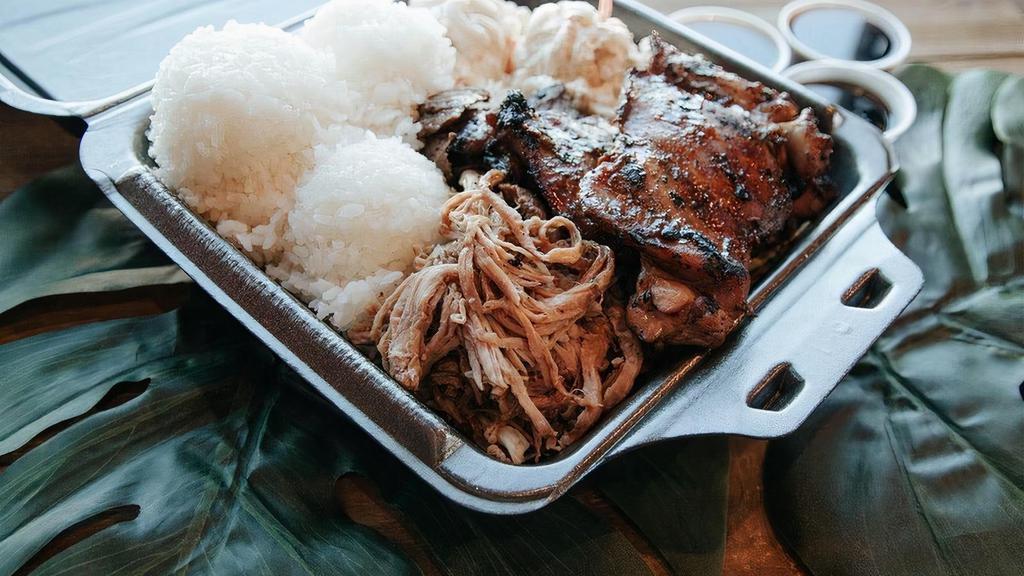Classic Ekolu · Original Ekolu - teriyaki steak, teriyaki chicken, and kalua pig served on a bed of cabbage with 3 scoops of rice, a salad choice, and 3 sauce cups.