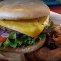 Cheeseburger · Over 1/3 lb fresh beef patty with cheese, lettuce, tomatoes, pickles, onion, and mustard.