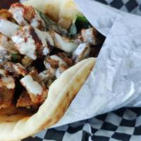 Gyro Wrap · Freshly grilled gyro meat wrapped in a toasted pita. served with lettuce (additional veggies...