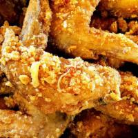 Chicken Wings · 6 pieces lightly dusted, fried & tossed in your choice of flavor.