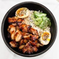 Teriyaki Chicken Don · Tender chicken pieces cooked with our house blend teriyaki sauce, served with on a bed of wa...