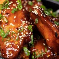 Win Wings · Juicy chicken wings stir fried in our secret sweet and spicy wing wing sauce