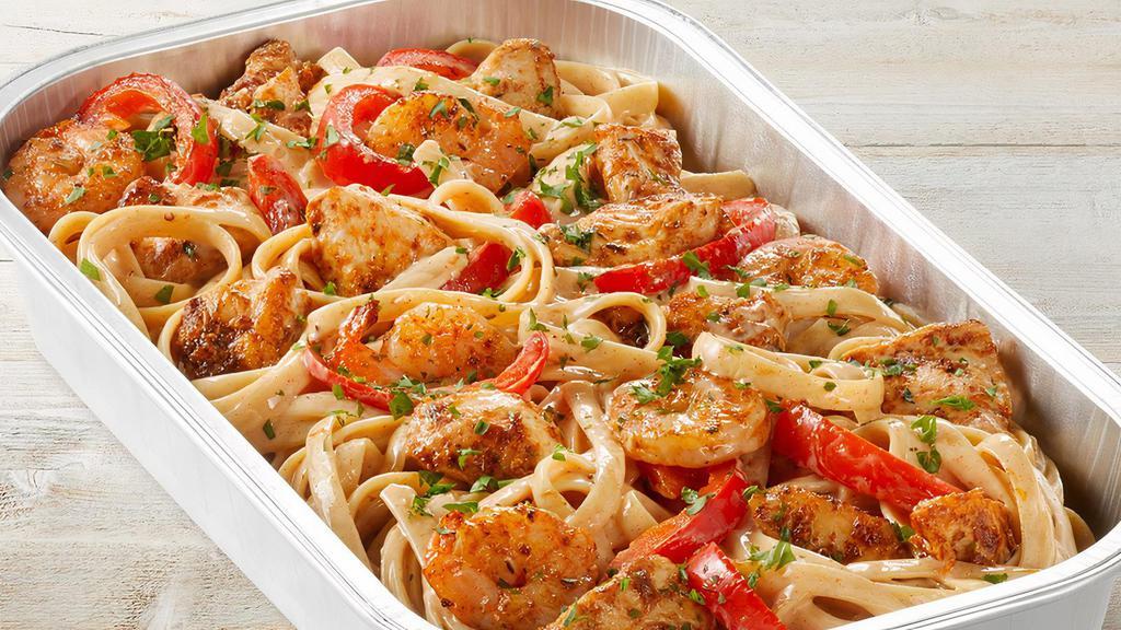 Fridays™ Cajun Shrimp & Chicken Pasta (Party Tray) · Sautéed shrimp, chicken, red bell peppers, spicy Cajun Alfredo sauce, Parmesan-Romano and fettuccine.
