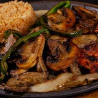 El Pollo Con Hongos · Marinated grilled chicken breast topped with sautéed mushrooms, onions and poblano peppers. ...