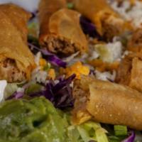 Chicken Flautas · Served with salad, guacamole, sour cream, rice, and beans.