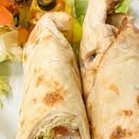 Chicken Shawerma Wrap · Chicken shawerma marinated in olive oil, oregano, black pepper, and paprika in a wrap with s...