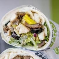Spicy Turmeric Falafel Wrap · Spicy turmeric falafel in a wrap with salad and tahini sauce.