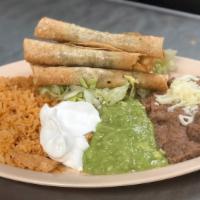 Beef Flautas · Four shredded beef flautas with guacamole sour cream. Served with rice and refried beans.