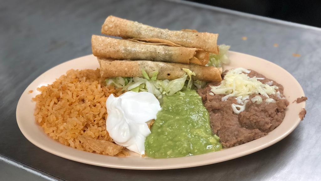 Beef Flautas · Four shredded beef flautas with guacamole sour cream. Served with rice and refried beans.