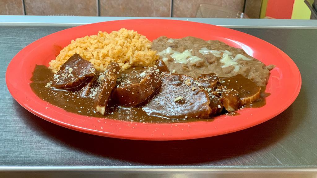 Mole Plate · Served with rice, refried beans, and tortillas.