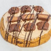Peanut Butter Cup · Our classic chocolate chip cookie frosted in peanut butter frosting topped with chopped rees...