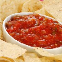 Chips & Salsa · Our secret recipe of homemade salsa served with a side of freshly fried chips. The Perfect A...