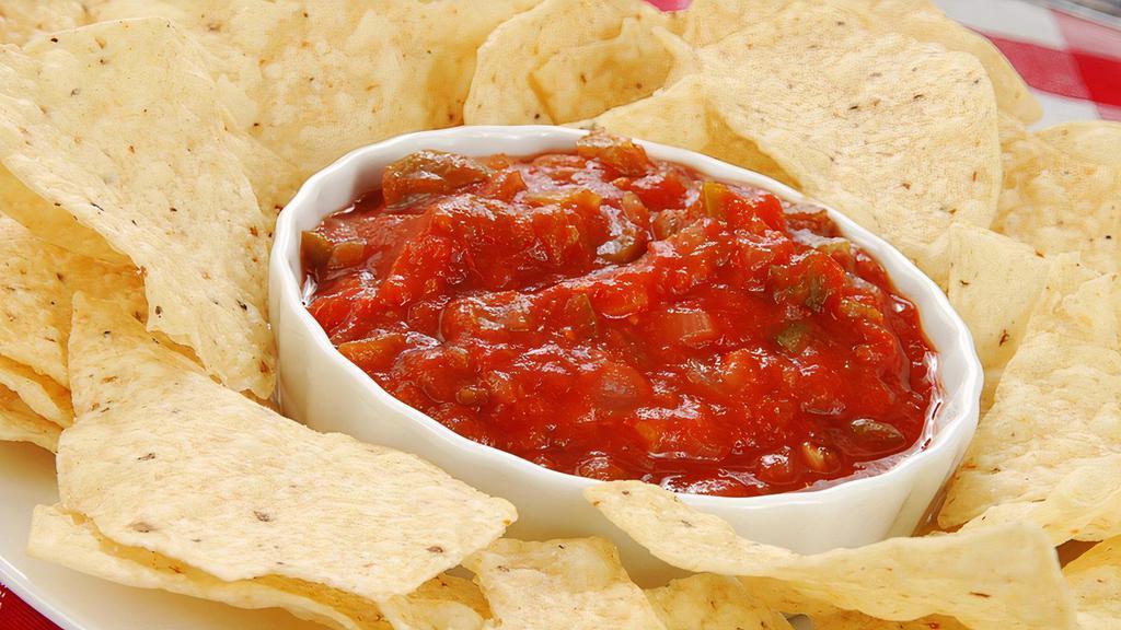 Chips & Salsa · Our secret recipe of homemade salsa served with a side of freshly fried chips. The Perfect Appetizer for Game day!