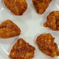 6 Piece Boneless Wings · Six boneless chicken wings covered in your choice of sauce or seasoning.