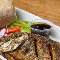 Kenkey Platter · Corn dough in corn husk, served either with whole tilapia/mackerel, served with pepper sauce...