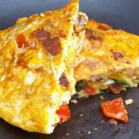 Mexican Omelette · Omelette with tomato, onions, peppers, diced ham served with hash-browns and beans.