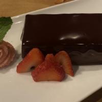 Chocolate Decadence · Flourless chocolate cake, callebaut dark chocolate mousse, whipped coconut, candied macadami...