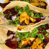 Tacos Cochinita (3) · Gluten-free. Shredded pork cooked wrapped in banana leaf, achiote sauce, pickled red onions,...