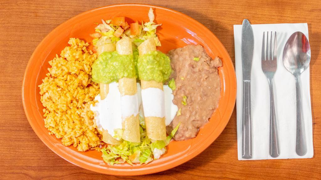 Flauta Plate · 3 beef or chicken flautas, guacamole, sour cream, fried beans, and Spanish rice.
