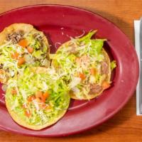 1 Meat Tostada, 1 Bean Tostada And 1 Guacamole Tostada · Topped with lettuce, tomatoes, and fresh cheese.
