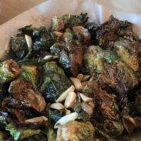 Crispy Brussel Sprouts · fried, balsamic glazed, and topped with roasted almonds