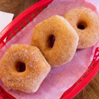 Cinnamon Sugar Covered · Our yeast-raised donut covered in cinnamon sugar.