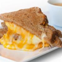 Kids Grilled Cheese · Artisan cheese blend on sliced wheat bread, served with a side of applesauce