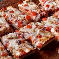 Chicken Parmesan Pizza · Pizza Sauce base, Mozzarella Cheese, Grilled Chicken Breast and tomato. Finished with a Butt...