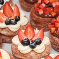 Cream Cheese Cronut · Cream cheese topped with berries.