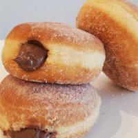 Nutella Filled · Cinnamon sugar round donut with nutella filling.