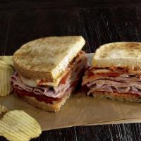The Carmela · Made with Nitrite-free ham, pepperoni, salami, provolone, piquillo relish and mayo grilled t...