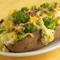 Spud Aubroc · One of our giant spuds loaded with Broccoli cheese soup, cheddar cheese, bacon bits, green o...