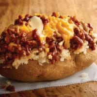 Texas Style Spud · Chopped pit-smoked beef brisket, barbecue sauce, cheddar, butter on a baked potato.