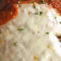Chicken Parmigiana · Lightly breaded and served in a tomato sauce and topped with mozzarella cheese.