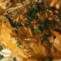 Tilapia Genovese · Tilapia, shrimp and crab meat sautéed with garlic and basil in a sherry wine marinara served...