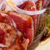 Tuna Tataki · Seared tuna with red onion and greens with spicy chili house dressing