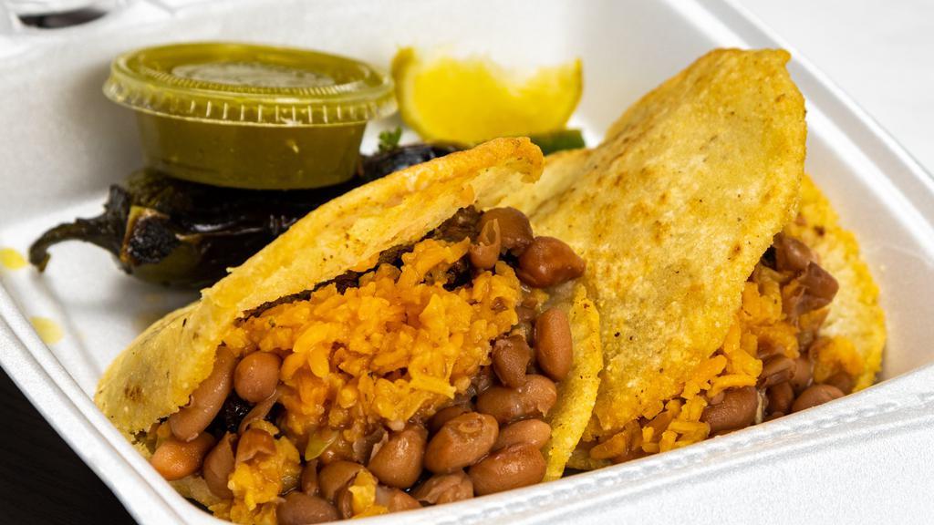 Gordita · Special handmade bread stuff with your choice of meat, rice, beans cheddar cheese, onions, cilantro and served with sour cream and green or red hot sauce.