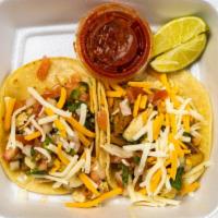 Fish Tacos · Grilled fish served on a soft corn or flour tortilla and topped with shredded cheese, pico d...