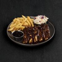 Fridays Big Ribs Whiskey-Glazed · Slow-cooked, fall-off-the-bone tender big back pork ribs fire-grilled and basted with Signat...