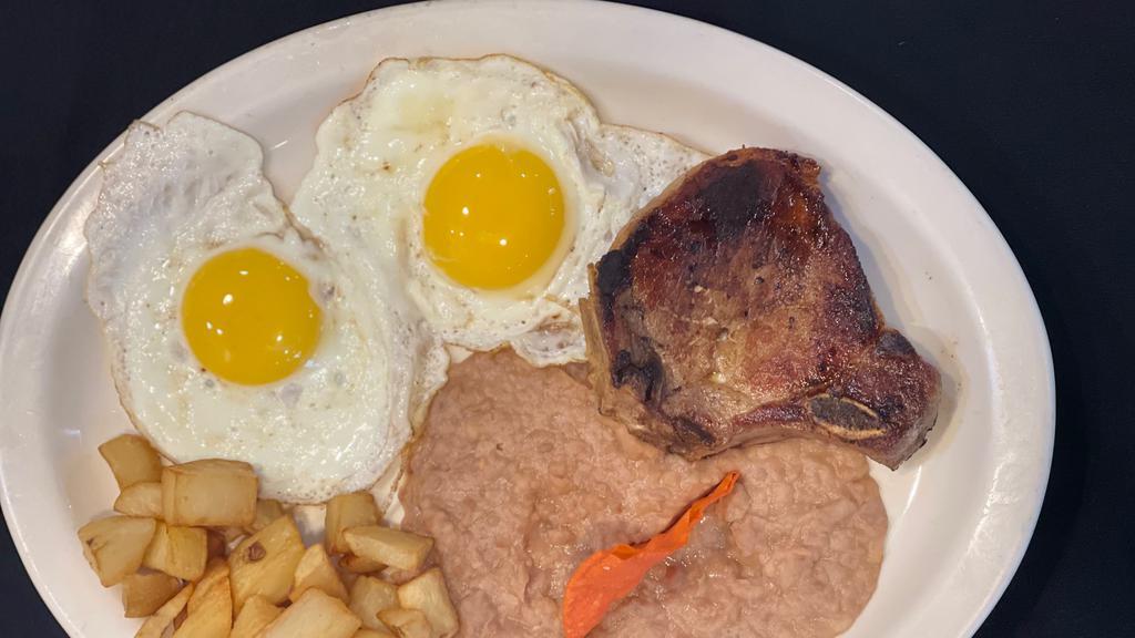 Pork Chops And Eggs Plate · Served with two eggs, refried beans, potatoes and ranchero sauce