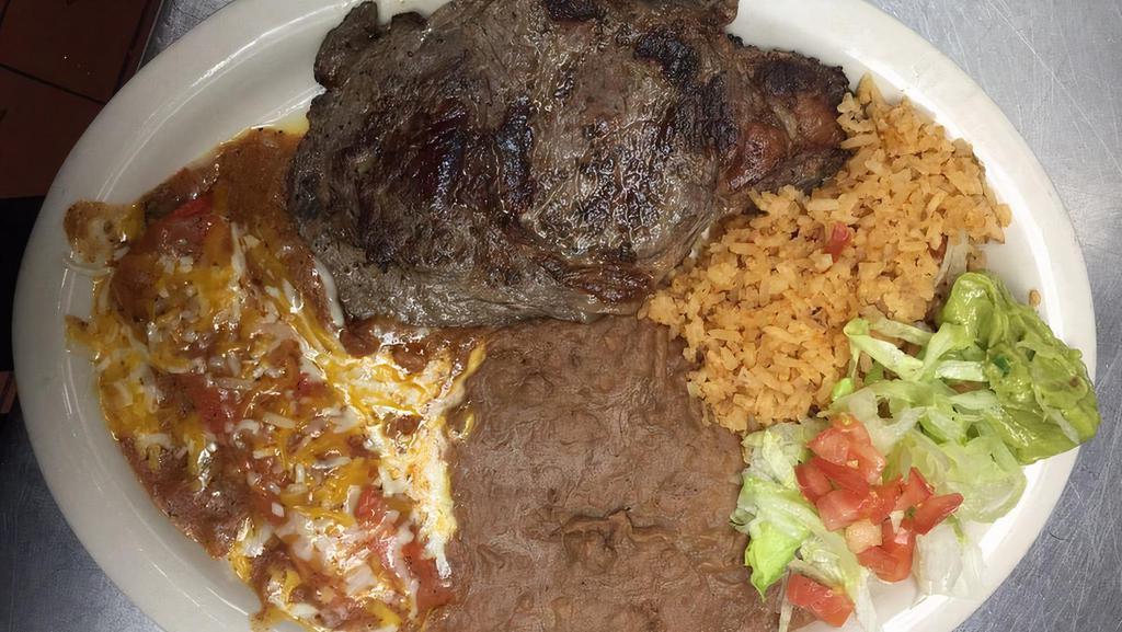 Tampiquena Style Plate · Steak served with one cheese enchilada, rice, beans, guacamole salad.