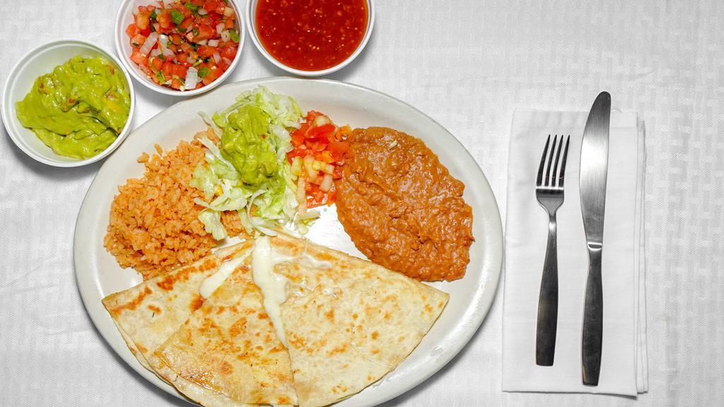 #17. Fajita Quesadilla · Beef or Chicken quesadilla, served with rice, beans & guacamole salad.