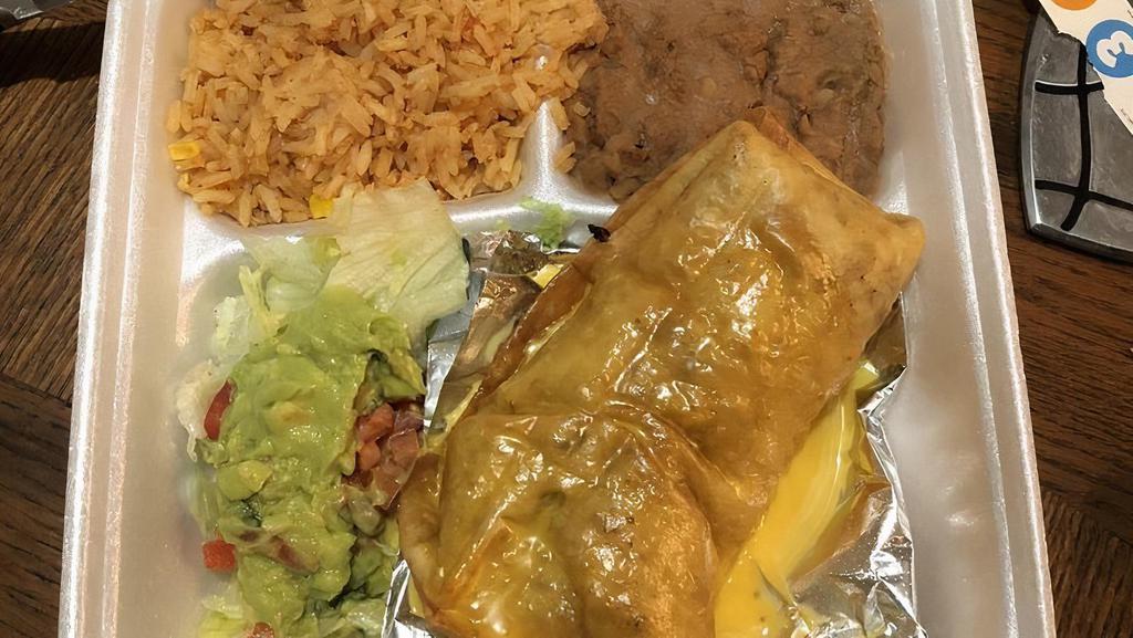 Chimichanga Plate · Fried burrito covered in melted cheese, served with rice, beans and salad.