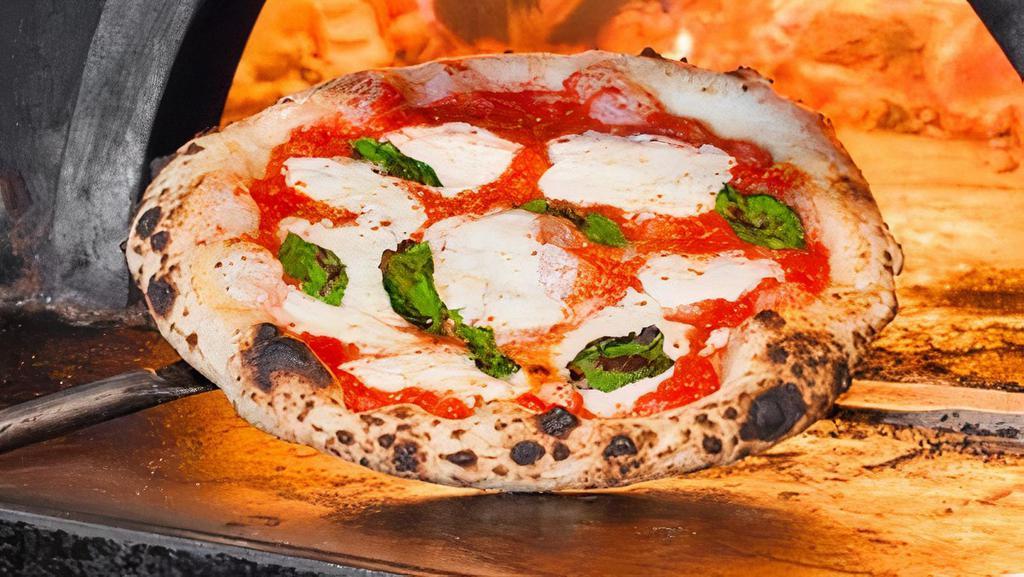 Margherita Pizza · Italian plum tomato sauce, basil, house made mozzarella