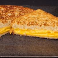 The Grilled Cheesy · American and Cheddar cheese melted between two pieces of our grilled, made-from-scratch whit...