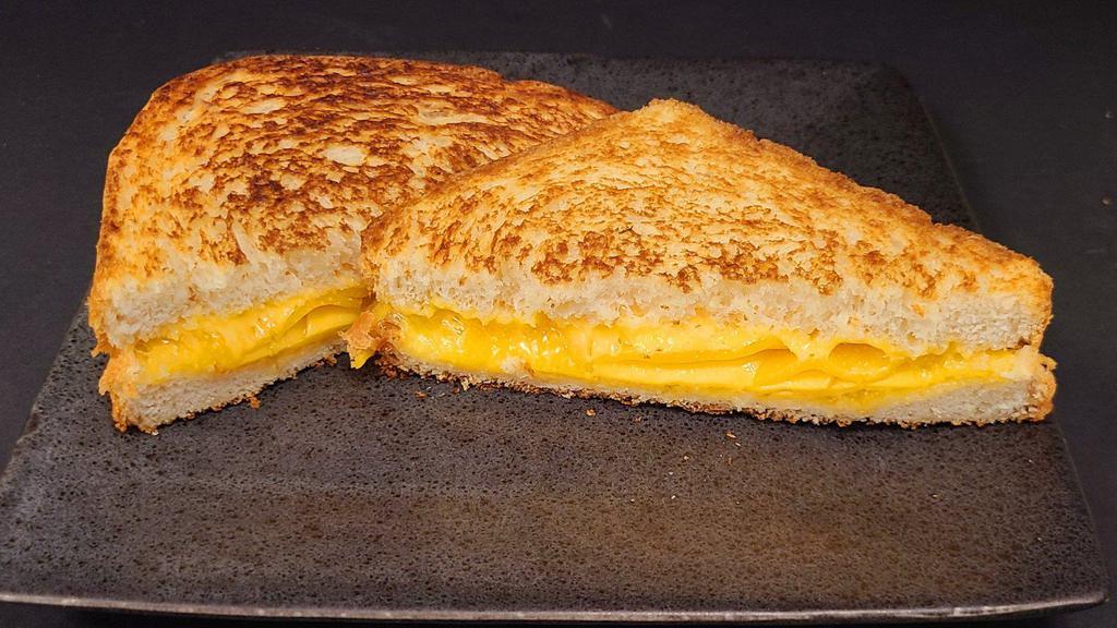 The Grilled Cheesy · American and Cheddar cheese melted between two pieces of our grilled, made-from-scratch white bread.
Consider adding toppings when ordering to shake things up!