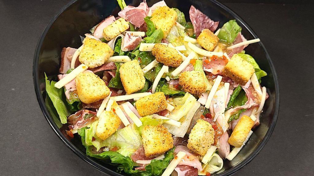 Italian Mafia Salad · Salami, Prosciutto, Ham, Capicola, shredded Provolone cheese, diced Tomatoes and croutons on a bed of
Iceberg Lettuce and Romaine.  Served with a side of Italian dressing.