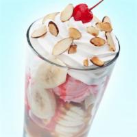 Upright Banana Split · Layered banana split starting with vanilla ice cream on bottom topped with chocolate syrup a...