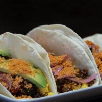 Vegetarian Taco · Avocado, peppers & onions, fresh scrambled eggs, salsa verde, pickled onion, and toasted che...