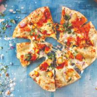 Tikka Pizza · Tikka Sauce, garlic, fresh mozzarella, red onions, tomatoes on a Naan crust topped with cila...